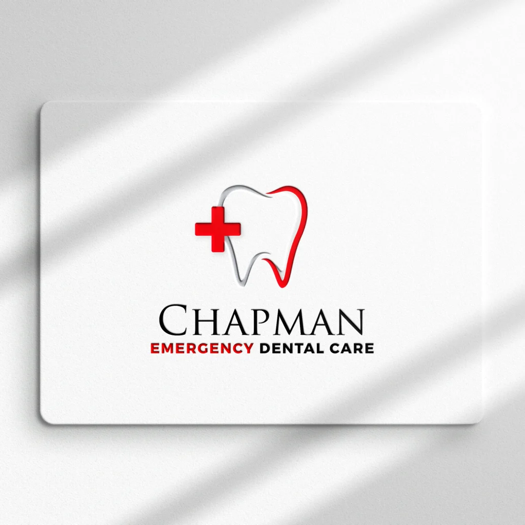 A white card with a red cross and tooth