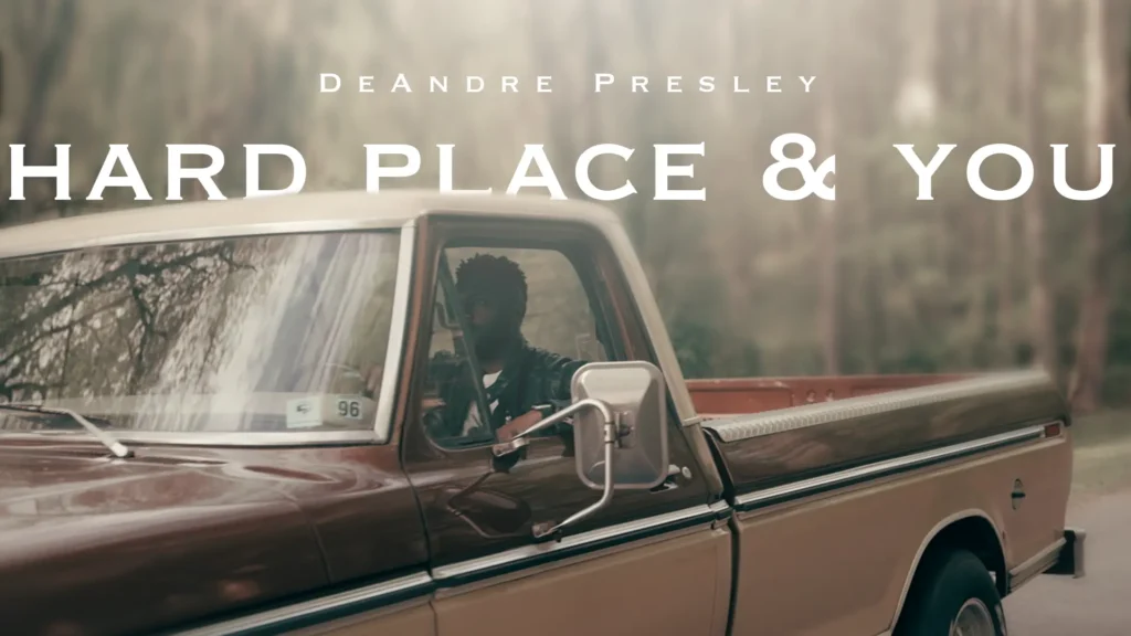 Deandre Presley drives a retro truck in the woods.