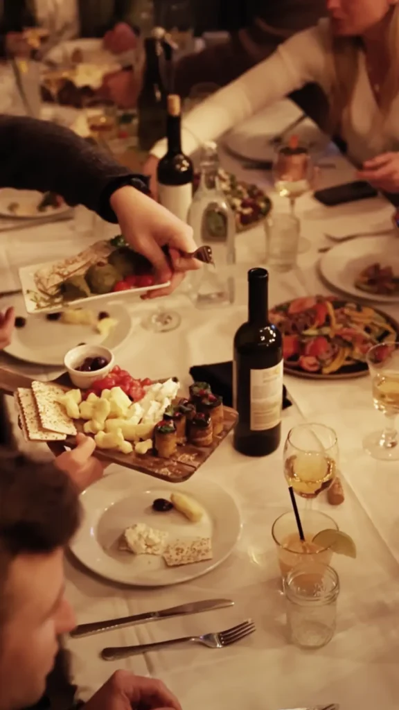 A wooden board with an assortment of appetizers.